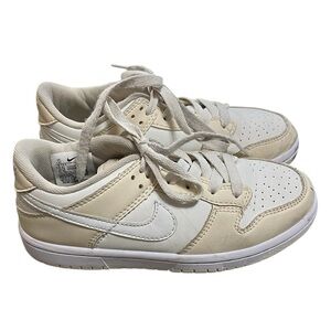 Nike low dunks lace up sneakers in cream and white